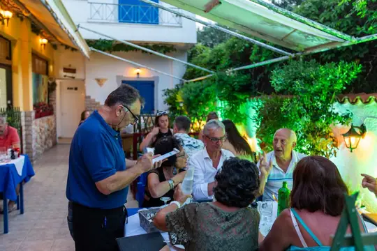 Pouring wine for guests at the table